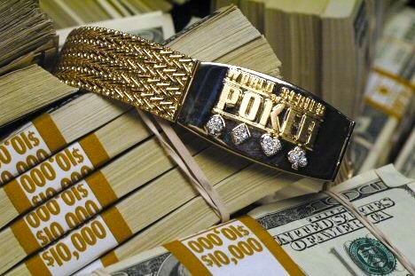 A World Series of Poker gold bracelet displayed in a case